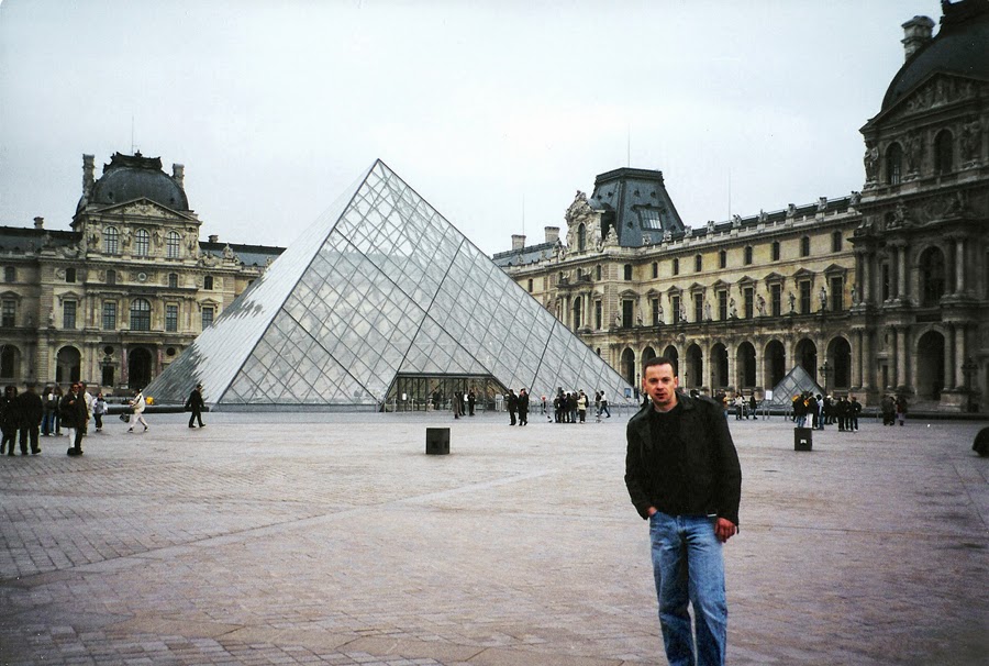 November 1999 - Standing in front of "Pyramide du Louvre."